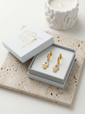 The Hamsa Hand Huggie Earrings view 5